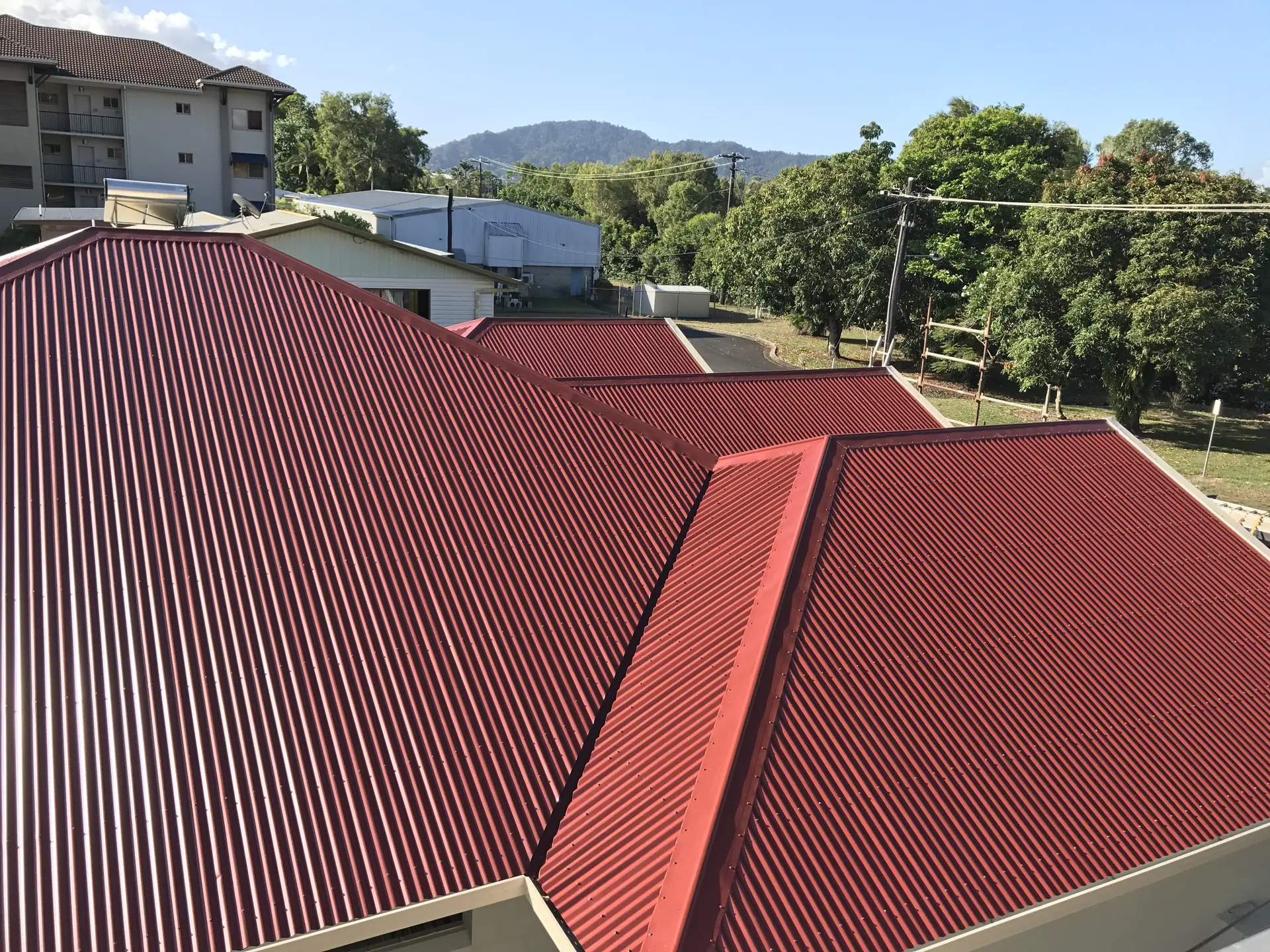 Red metal roof on a new home